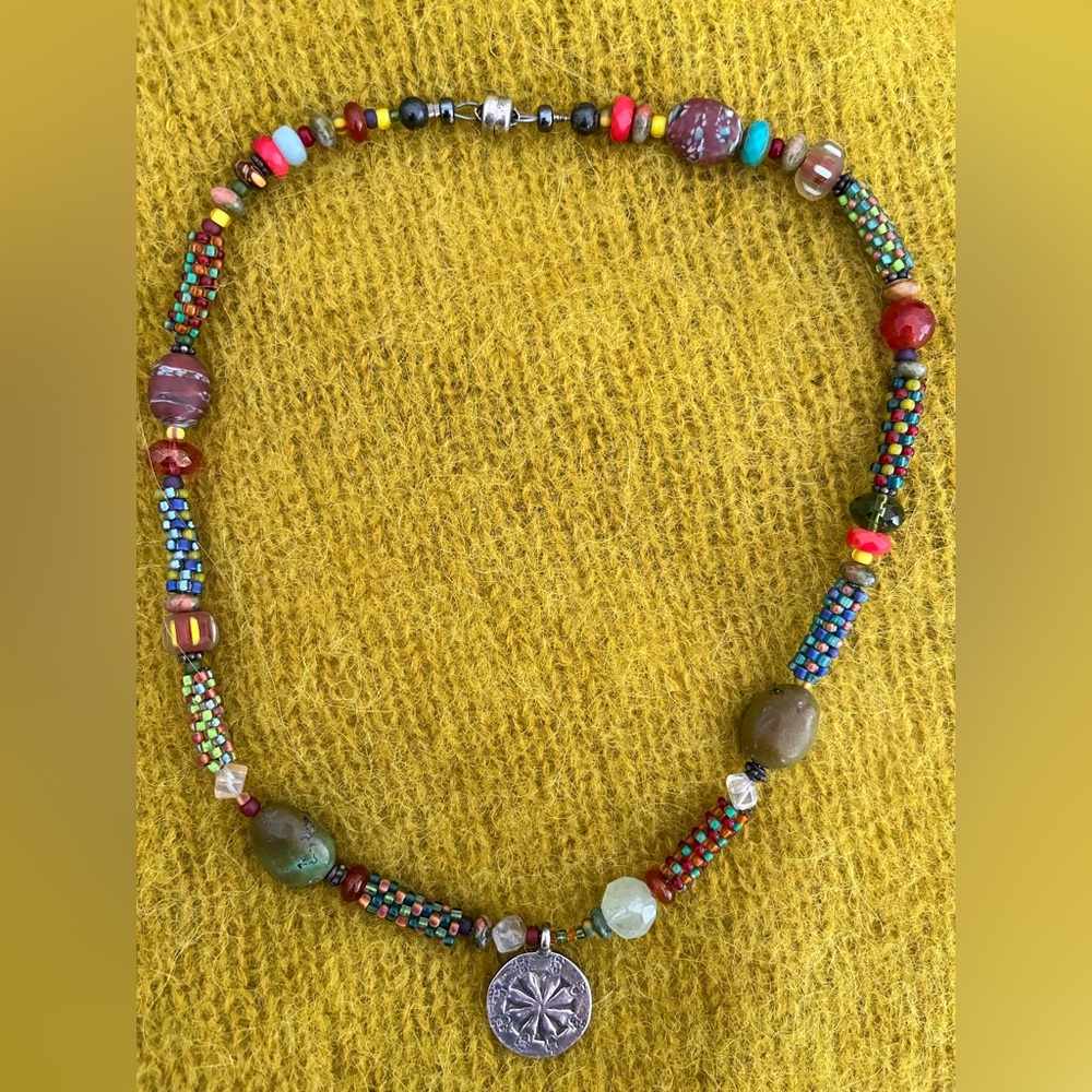 Artisan created beaded necklace with Thai silver pendant. 16”.